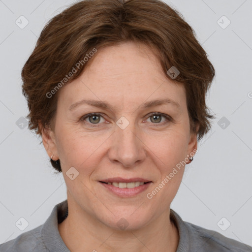 Joyful white adult female with short  brown hair and grey eyes