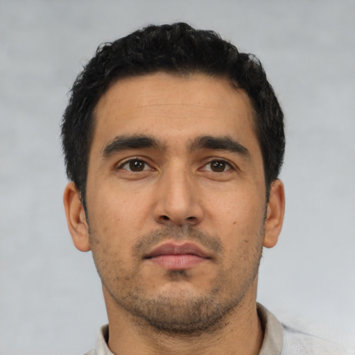 Neutral latino young-adult male with short  black hair and brown eyes