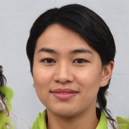 Joyful asian young-adult female with medium  brown hair and brown eyes