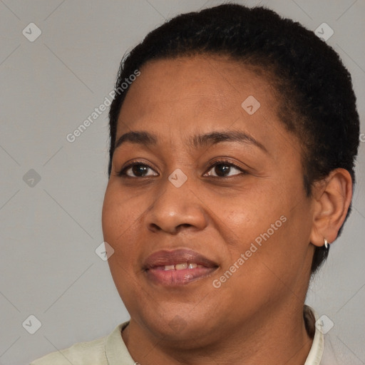 Joyful black adult female with short  brown hair and brown eyes