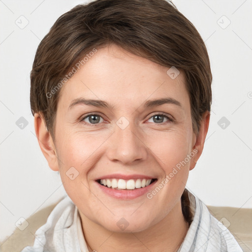 Joyful white young-adult female with short  brown hair and grey eyes