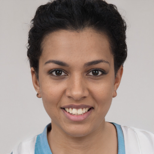 Joyful white young-adult female with short  black hair and brown eyes