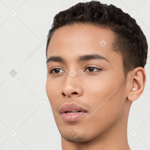 Neutral latino young-adult male with short  black hair and brown eyes