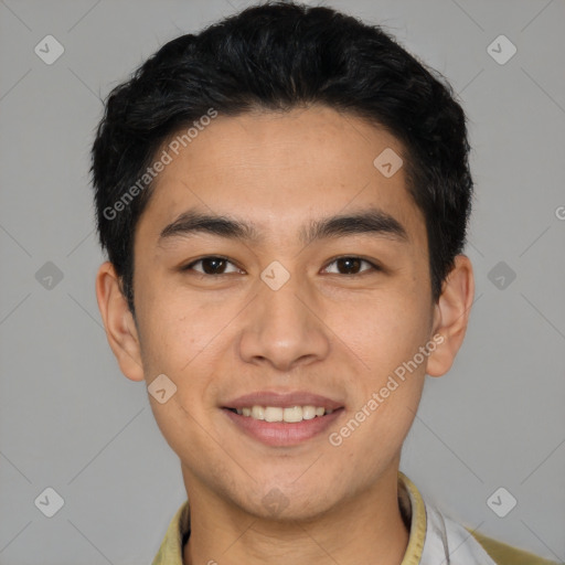 Joyful white young-adult male with short  black hair and brown eyes