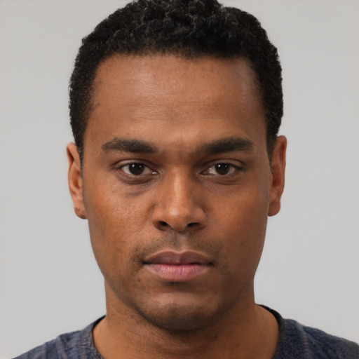 Neutral black young-adult male with short  black hair and brown eyes