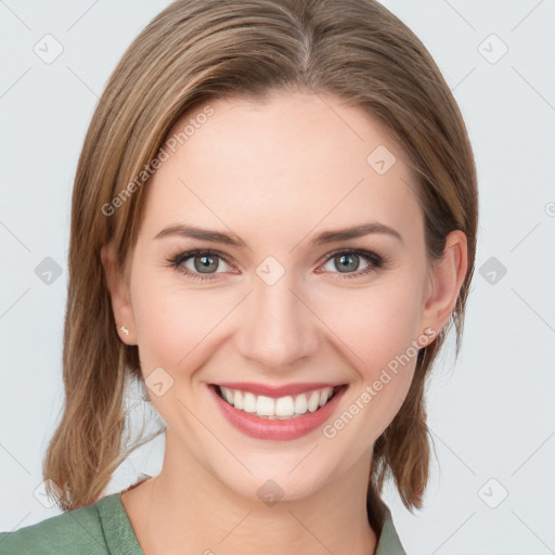 Joyful white young-adult female with medium  brown hair and blue eyes