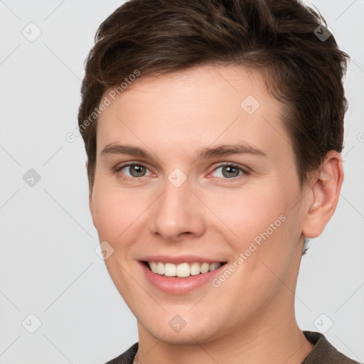 Joyful white young-adult female with short  brown hair and grey eyes