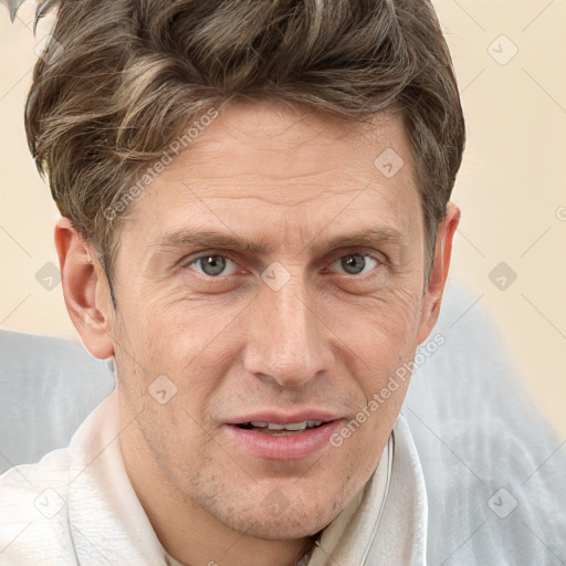 Joyful white adult male with short  brown hair and grey eyes