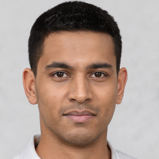 Neutral latino young-adult male with short  black hair and brown eyes