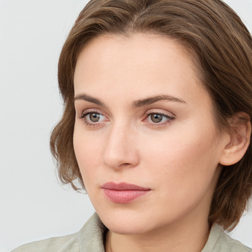 Neutral white young-adult female with medium  brown hair and grey eyes