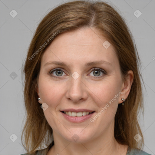 Joyful white adult female with medium  brown hair and grey eyes