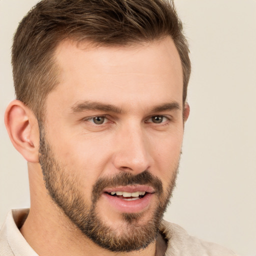 Joyful white young-adult male with short  brown hair and brown eyes