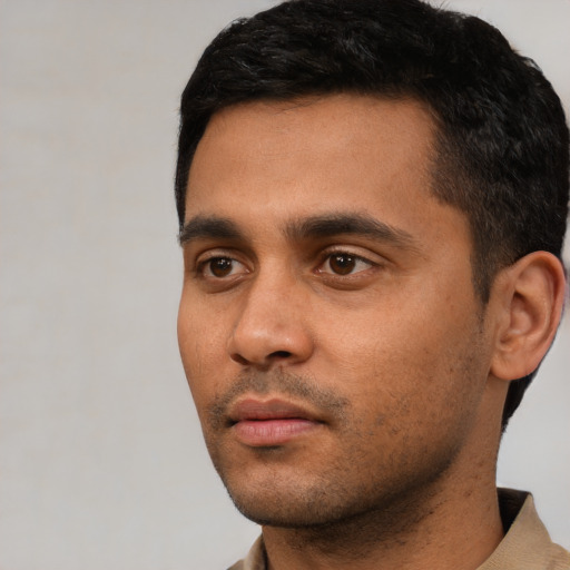 Neutral latino young-adult male with short  black hair and brown eyes