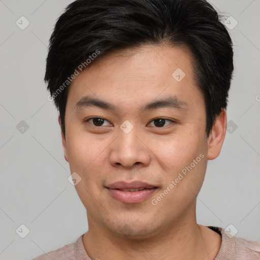 Joyful asian young-adult male with short  brown hair and brown eyes