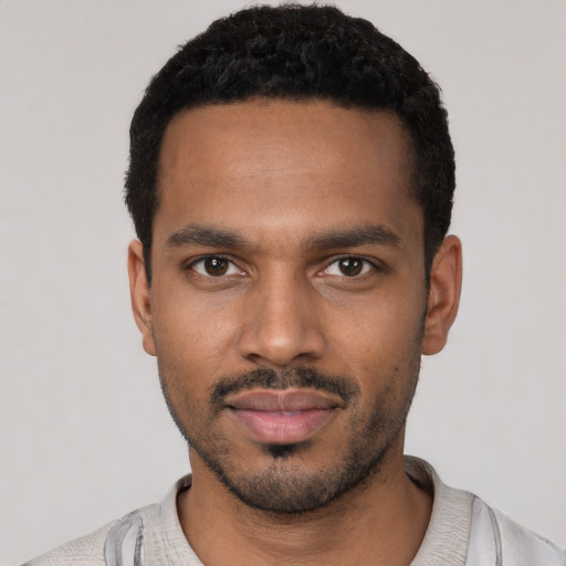 Neutral black young-adult male with short  black hair and brown eyes