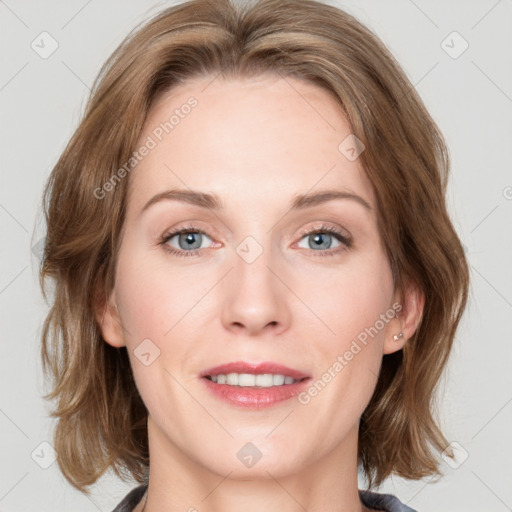 Joyful white adult female with medium  brown hair and blue eyes