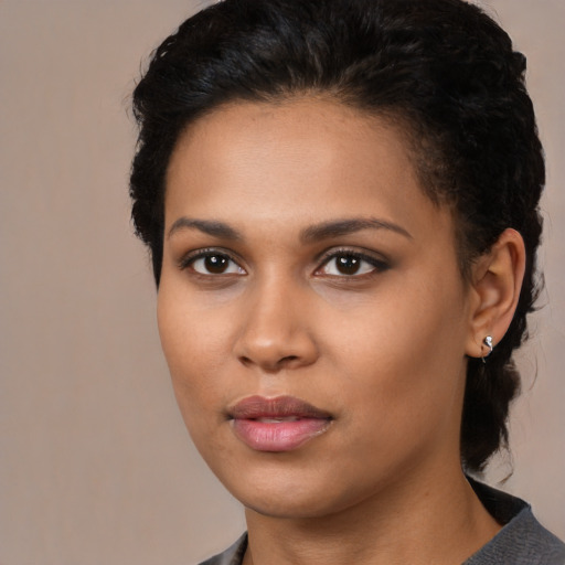 Neutral latino young-adult female with medium  brown hair and brown eyes