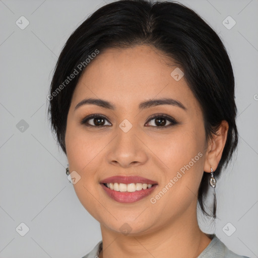 Joyful latino young-adult female with medium  brown hair and brown eyes