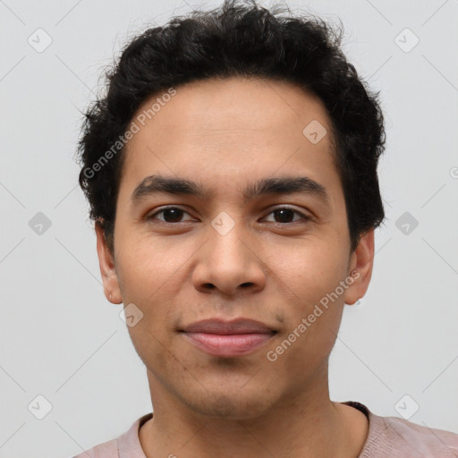 Joyful latino young-adult male with short  brown hair and brown eyes