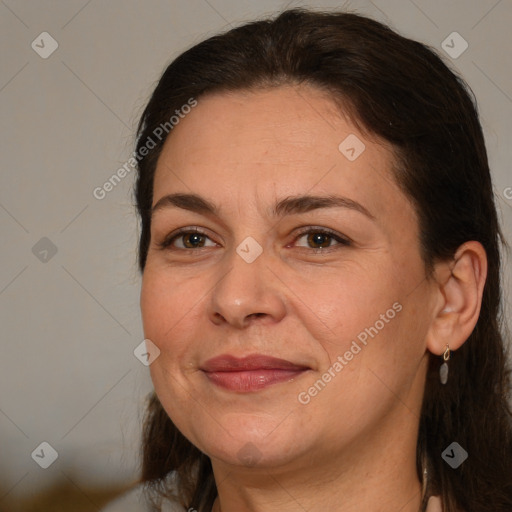 Joyful white adult female with medium  brown hair and brown eyes