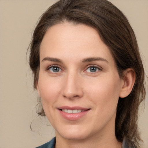 Joyful white young-adult female with medium  brown hair and brown eyes