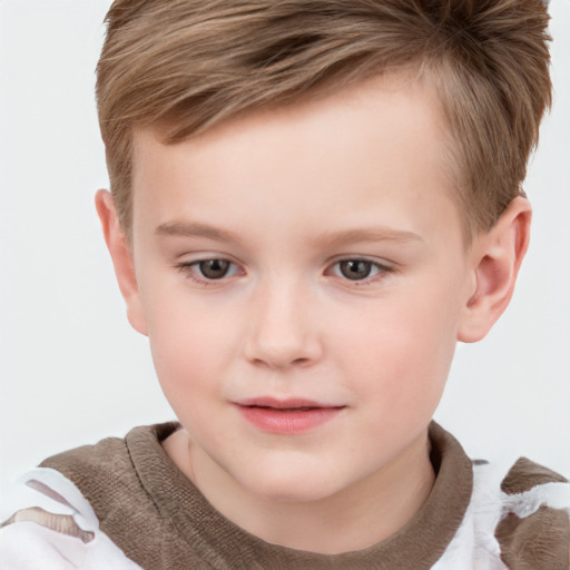 Joyful white child male with short  brown hair and brown eyes