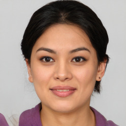 Joyful asian young-adult female with medium  brown hair and brown eyes