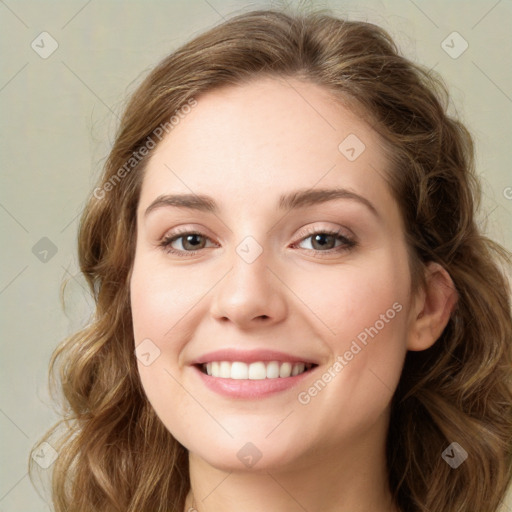 Joyful white young-adult female with long  brown hair and green eyes