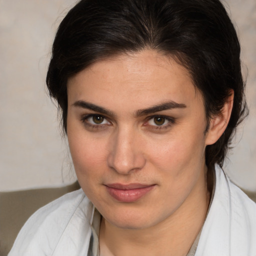 Joyful white young-adult female with medium  brown hair and brown eyes