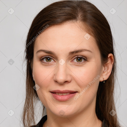 Joyful white young-adult female with long  brown hair and brown eyes