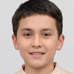 Joyful white child male with short  brown hair and brown eyes