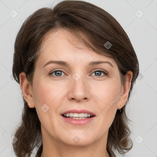 Joyful white young-adult female with medium  brown hair and grey eyes