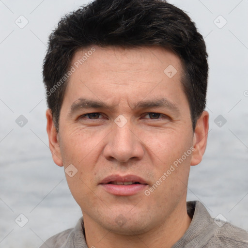 Joyful white adult male with short  brown hair and grey eyes