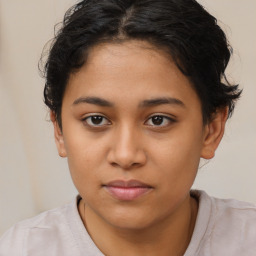 Joyful latino young-adult female with short  brown hair and brown eyes