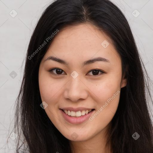 Joyful asian young-adult female with long  brown hair and brown eyes