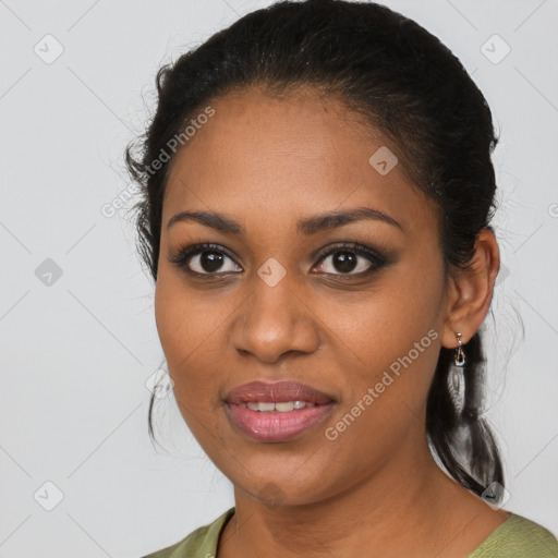 Joyful black young-adult female with medium  brown hair and brown eyes