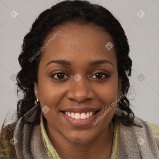 Joyful black young-adult female with long  brown hair and brown eyes