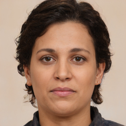 Neutral white adult female with medium  brown hair and brown eyes