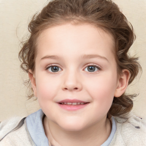 Joyful white child female with medium  brown hair and blue eyes