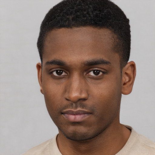 Neutral black young-adult male with short  black hair and brown eyes