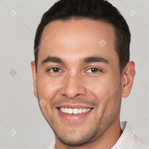 Joyful white young-adult male with short  black hair and brown eyes