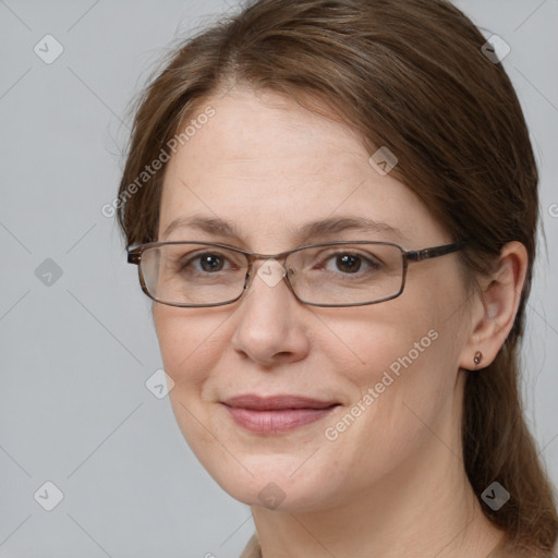 Joyful white adult female with medium  brown hair and grey eyes