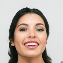 Joyful white young-adult female with long  black hair and brown eyes