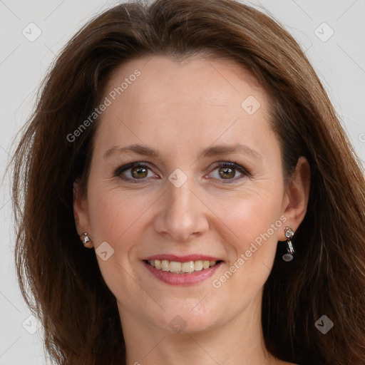 Joyful white adult female with long  brown hair and grey eyes