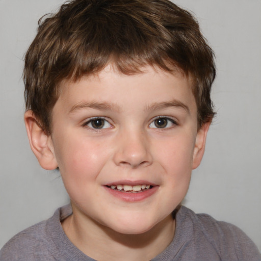 Joyful white child male with short  brown hair and grey eyes