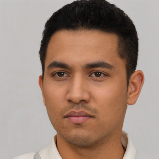 Neutral latino young-adult male with short  black hair and brown eyes