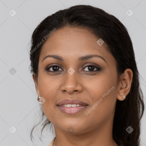 Joyful latino young-adult female with long  brown hair and brown eyes