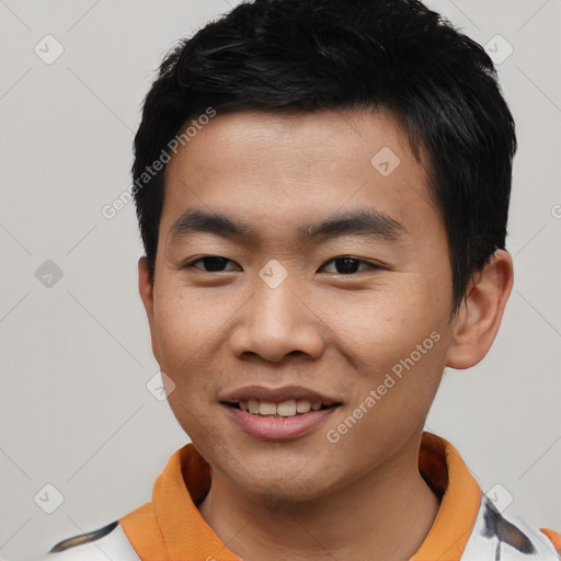 Joyful asian young-adult male with short  black hair and brown eyes