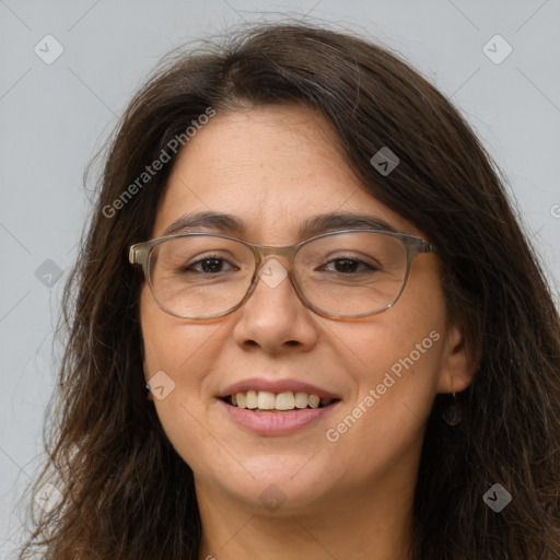 Joyful white adult female with long  brown hair and brown eyes