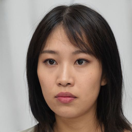 Neutral asian young-adult female with long  brown hair and brown eyes